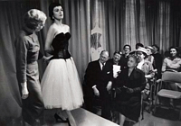 1 model wearing a corset on runway