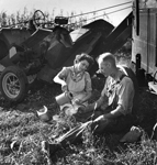 coffe break in front of corn picker