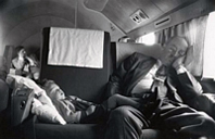 Congressman and baby sleeping on plane